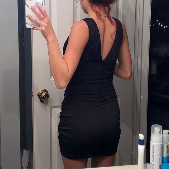 Cute little black dress with a v cut front and back. - Picture 3 of 4